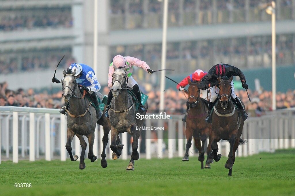 14 March 2012; Champagne Fever, centre, with Patrick Mullins up, on the way to winning the Weatherbys Champion Bumper from eventual second Pique Sous, right, with Ruby Walsh up, and eventual third, New Year's Eve, with Barry Geraghty up. Cheltenham Racing Festival, Prestbury Park, Cheltenham, England. Picture credit: Matt Browne / SPORTSFILE