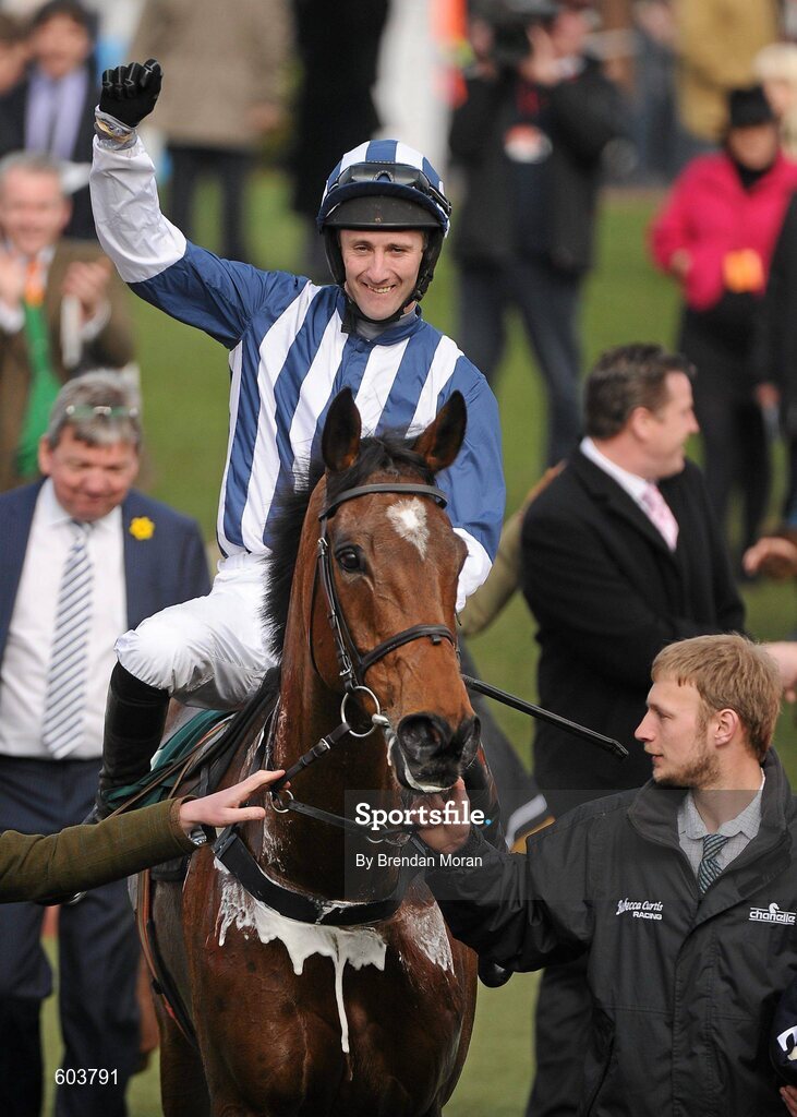14 March 2012; Jockey John Thomas McNamara, aboard Teaforthree, celebrates winning the Diamond Jubilee National Hunt Steeple Chase. Cheltenham Racing Festival, Prestbury Park, Cheltenham, England. Picture credit: Brendan Moran / SPORTSFILE