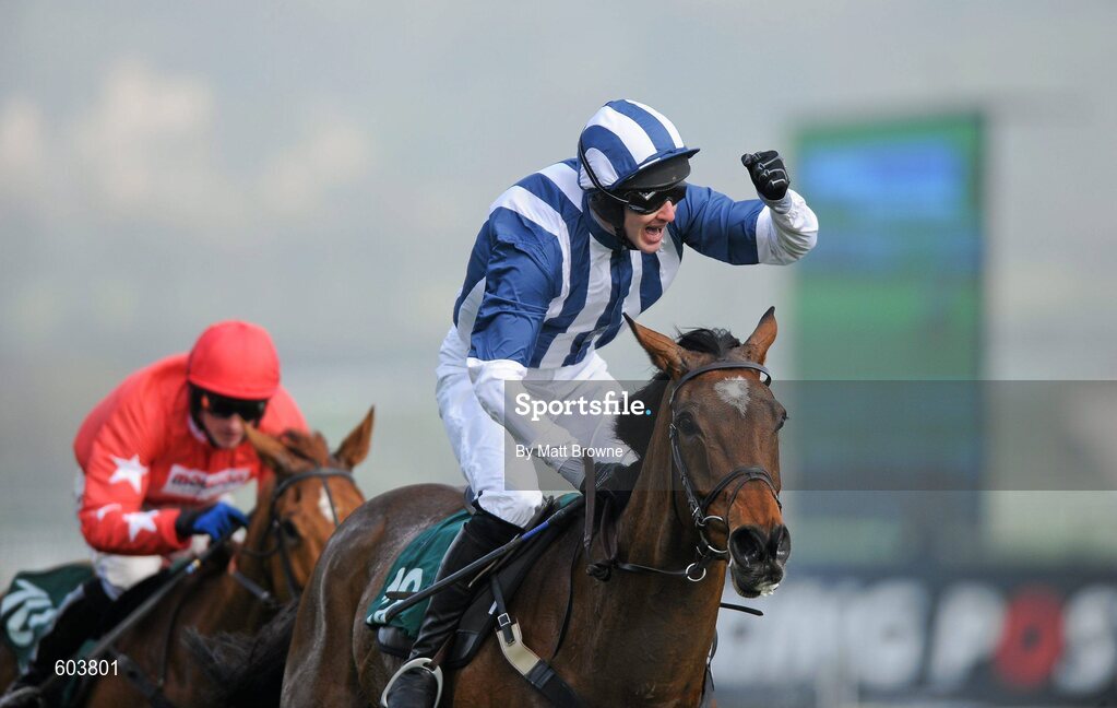 14 March 2012; Jockey John Thomas McNamara, aboard Teaforthree, celebrates after winning the Diamond Jubilee National Hunt Steeple Chase. Cheltenham Racing Festival, Prestbury Park, Cheltenham, England. Picture credit: Matt Browne / SPORTSFILE