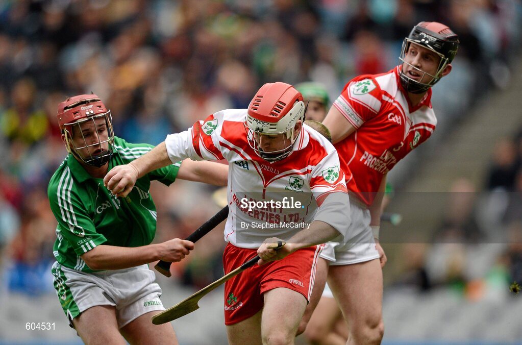 17 March 2012; Damian Quinn, Loughgiel Shamrocks, with support from team-mate Neill McGarry, right, in action against Eoin Ryan, Coolderry. AIB GAA Hurling All-Ireland Senior Club Championship Final, Coolderry, Offaly, v Loughgiel Shamrocks, Antrim. Croke Park, Dublin. Picture credit: Stephen McCarthy / SPORTSFILE
