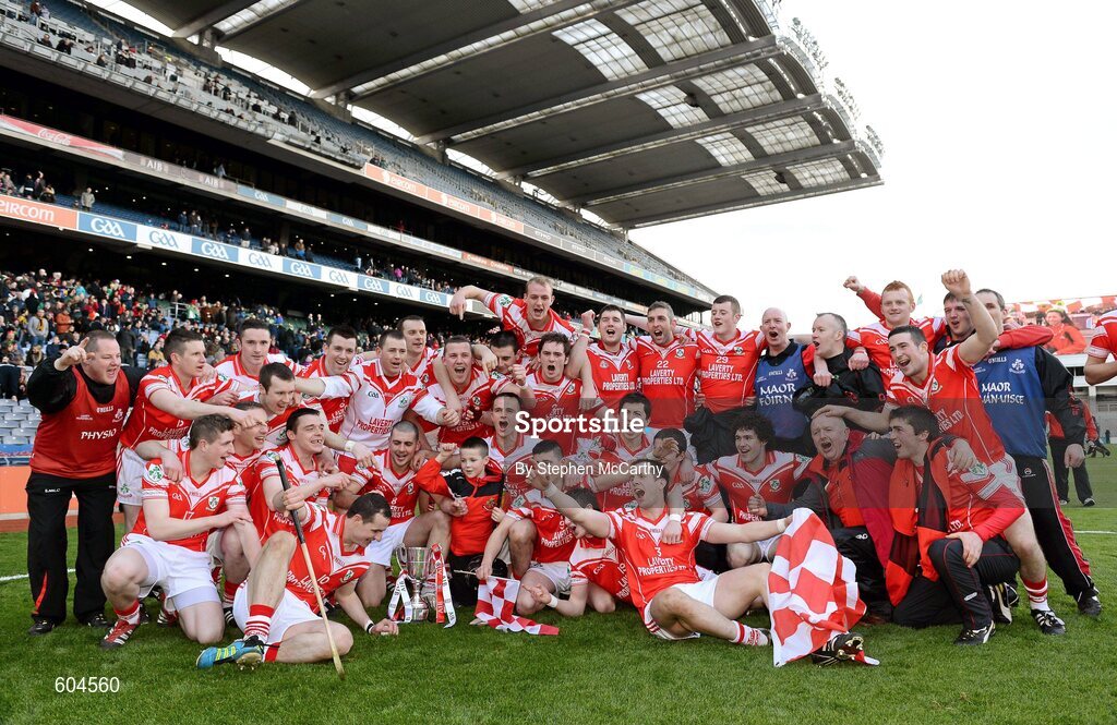 17 March 2012; Loughgiel Shamrocks players and management celebrate with the Tommy Moore Cup. AIB GAA Hurling All-Ireland Senior Club Championship Final, Coolderry, Offaly, v Loughgiel Shamrocks, Antrim. Croke Park, Dublin. Picture credit: Stephen McCarthy / SPORTSFILE