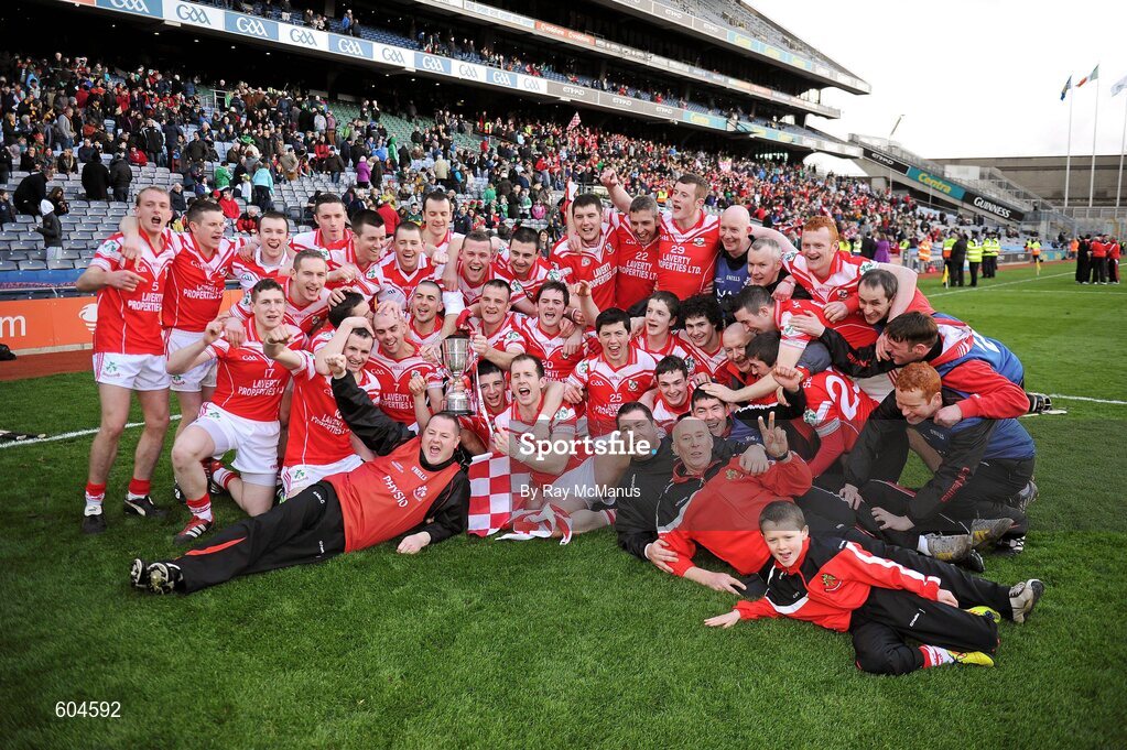 17 March 2012; Members of the Loughgiel Shamrocks squad celebrate with the Tommy Moore Cup. AIB GAA Hurling All-Ireland Senior Club Championship Final, Coolderry, Offaly, v Loughgiel Shamrocks, Antrim, Croke Park, Dublin. Picture credit: Ray McManus / SPORTSFILE