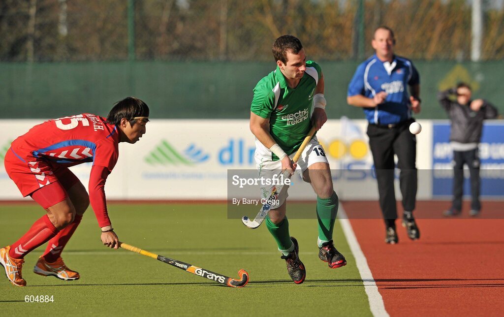 18 March 2012; Peter Caruth, Ireland, in action against Jong Hyun Jang, Korea. Men’s 2012 Olympic Qualifying Tournament Final, Ireland v Korea. National Hockey Stadium, UCD, Belfield, Dublin. Picture credit: Barry Cregg / SPORTSFILE