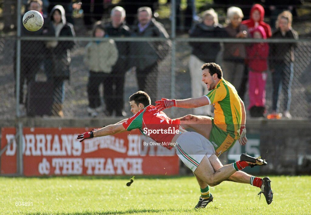 18 March 2012; Michael Murphy, Donegal, scores a point dispite the attempted block of Ger Cafferkey, Mayo. Allianz Football League, Division 1, Round 5, Donegal v Mayo, Fr. Tierney Park, Ballyshannon, Donegal. Picture credit: Oliver McVeigh / SPORTSFILE