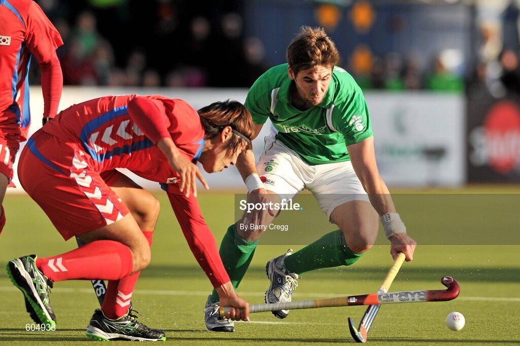 18 March 2012; William Geoffrey McCabe, Ireland, in action against Hyun Woo Nam, Korea. Men’s 2012 Olympic Qualifying Tournament Final, Ireland v Korea. National Hockey Stadium, UCD, Belfield, Dublin. Picture credit: Barry Cregg / SPORTSFILE