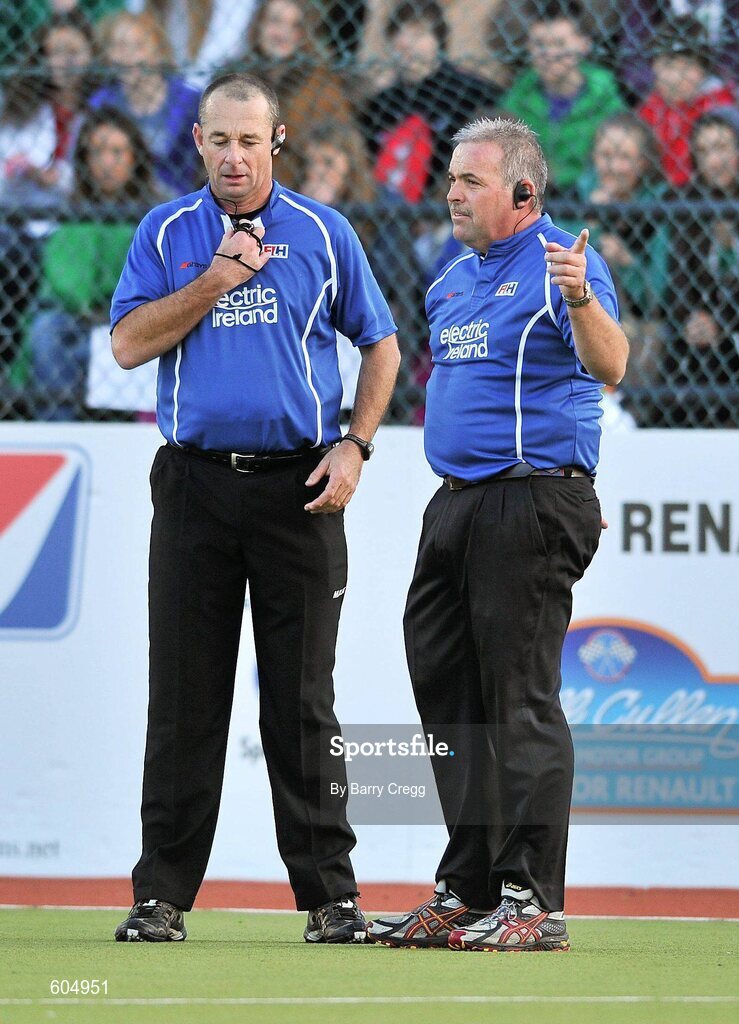 18 March 2012; Umpires Gary Simmonds, left, and Grime Murray award a late goal to Korea after they received confirmation from video umpire Deon Nel. Men’s 2012 Olympic Qualifying Tournament Final, Ireland v Korea. National Hockey Stadium, UCD, Belfield, Dublin. Picture credit: Barry Cregg / SPORTSFILE