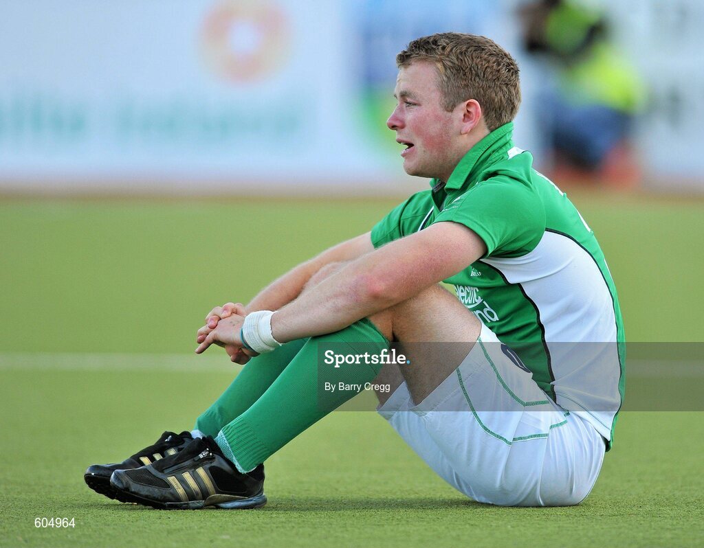 18 March 2012; A dejected Stuart Loughrey, Ireland, after the game. Men’s 2012 Olympic Qualifying Tournament Final, Ireland v Korea. National Hockey Stadium, UCD, Belfield, Dublin. Picture credit: Barry Cregg / SPORTSFILE