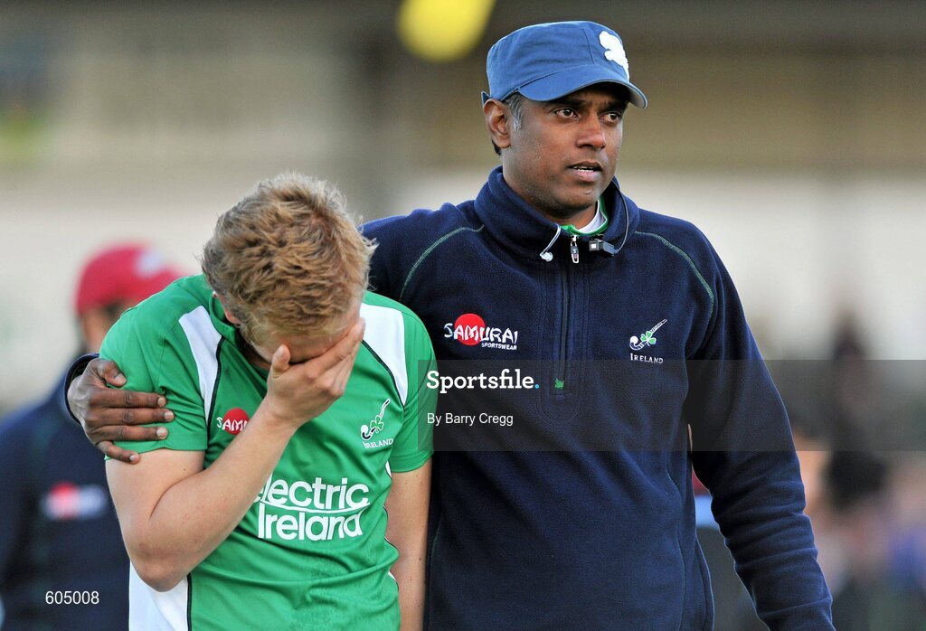 18 March 2012; A dejected Michael Watt, Ireland, is comforted by assistant coach Arul Anthoni, right, after the game. Men’s 2012 Olympic Qualifying Tournament Final, Ireland v Korea. National Hockey Stadium, UCD, Belfield, Dublin. Picture credit: Barry Cregg / SPORTSFILE