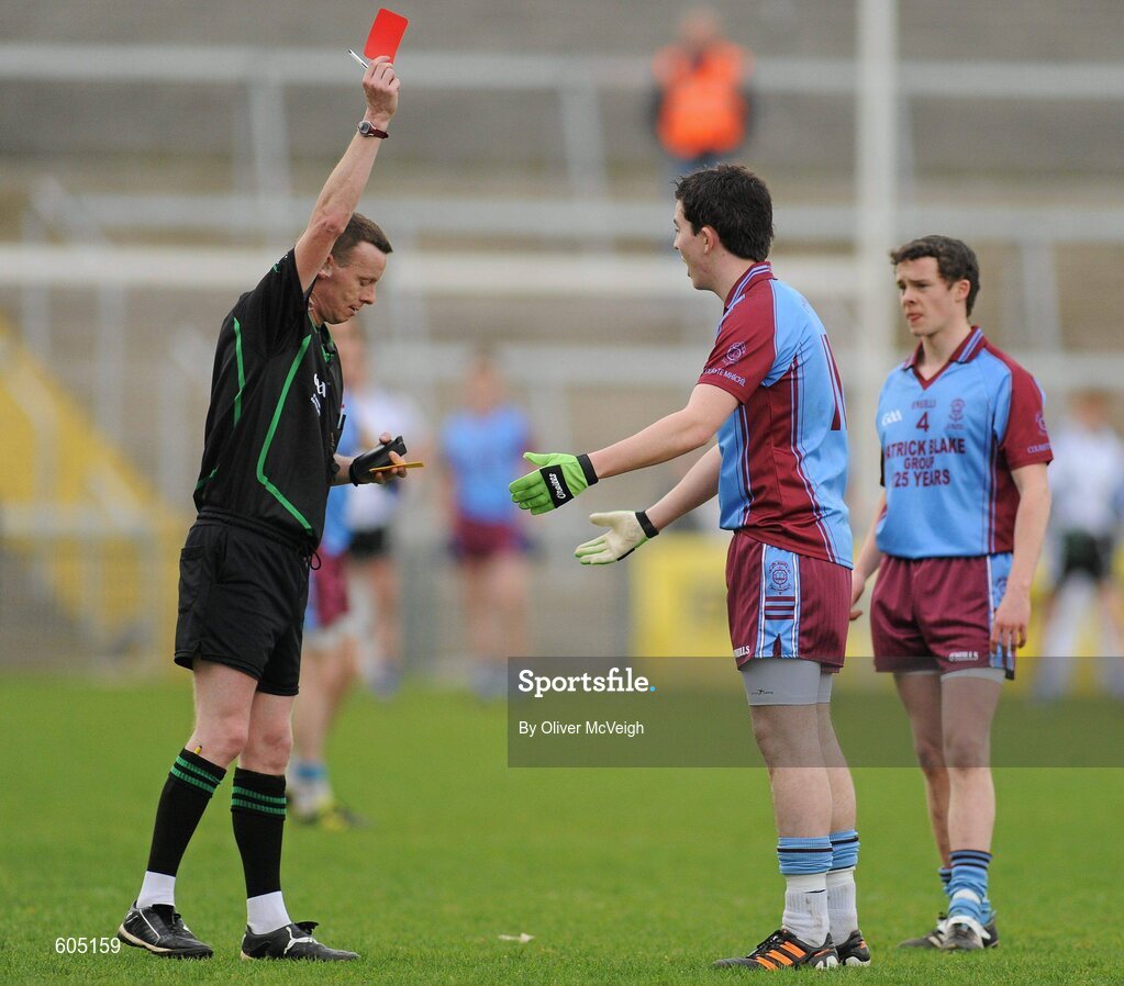 19 March 2012; Referee Joe McQuillan, issues Liam Martin, St. Michael’s, Enniskillen, with a red card during the second half. MacRory Cup Final, St. Patrick’s, Maghera v St. Michael’s, Enniskillen, Bessbrook, Morgan Athletic Grounds, Armagh. Picture credit: Oliver McVeigh / SPORTSFILE