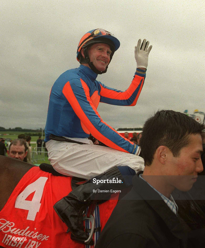 30 June 2002; Jockey Mick Kinane celebrates after winning the Budweiser Irish Derby on High Chaparral at The Curragh Racecourse in Kildare. Photo by Damien Eagers/Sportsfile