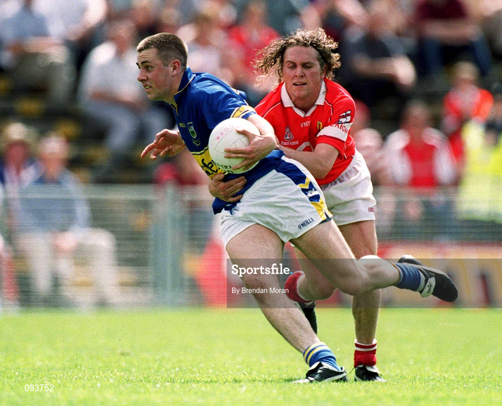14 July 2002; Niall Fitzgerald of Tipperary in action against Alan Cronin of Cork during the Bank of Ireland Munster Senior Football Championship Final match between Cork and Tipperary at Semple Stadium in Thurles, Tipperary. Photo by Brendan Moran/Sportsfile