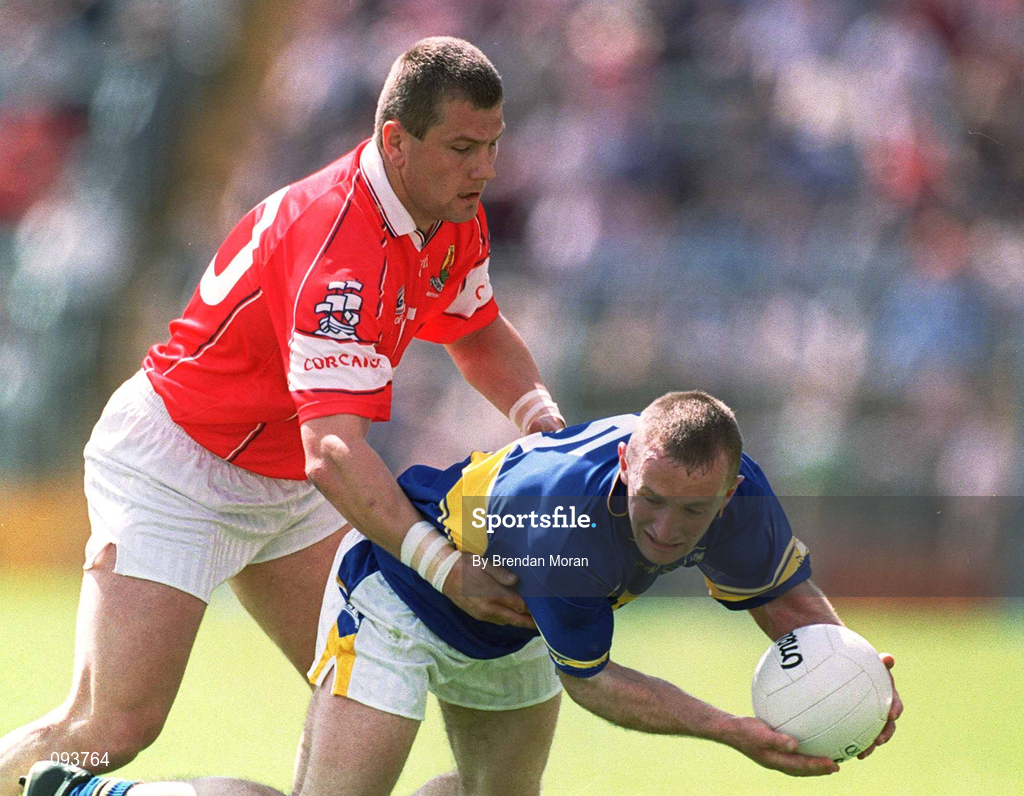 14 July 2002; Bernard Hahessy of Tipperary in action against Diarmuid O'Sullivan of Cork during the Bank of Ireland Munster Senior Football Championship Final match between Cork and Tipperary at Semple Stadium in Thurles, Tipperary. Photo by Brendan Moran/Sportsfile