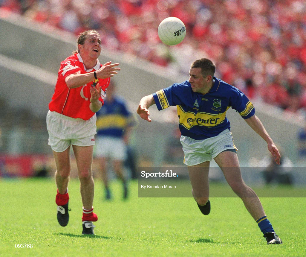 14 July 2002; Alan Cronin of Cork in action against Niall Fitzgerald of Tipperary during the Bank of Ireland Munster Senior Football Championship Final match between Cork and Tipperary at Semple Stadium in Thurles, Tipperary. Photo by Brendan Moran/Sportsfile