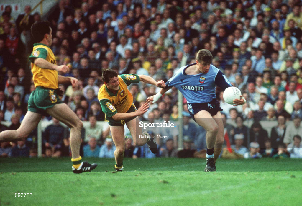 20 September 1992; Charlie Redmond of Dublin is tackled by JJ Doherty of Donegal during the All-Ireland Senior Football Championship Final between Dublin and Donegal at Croke Park in Dublin. Photo by David Maher/Sportsfile