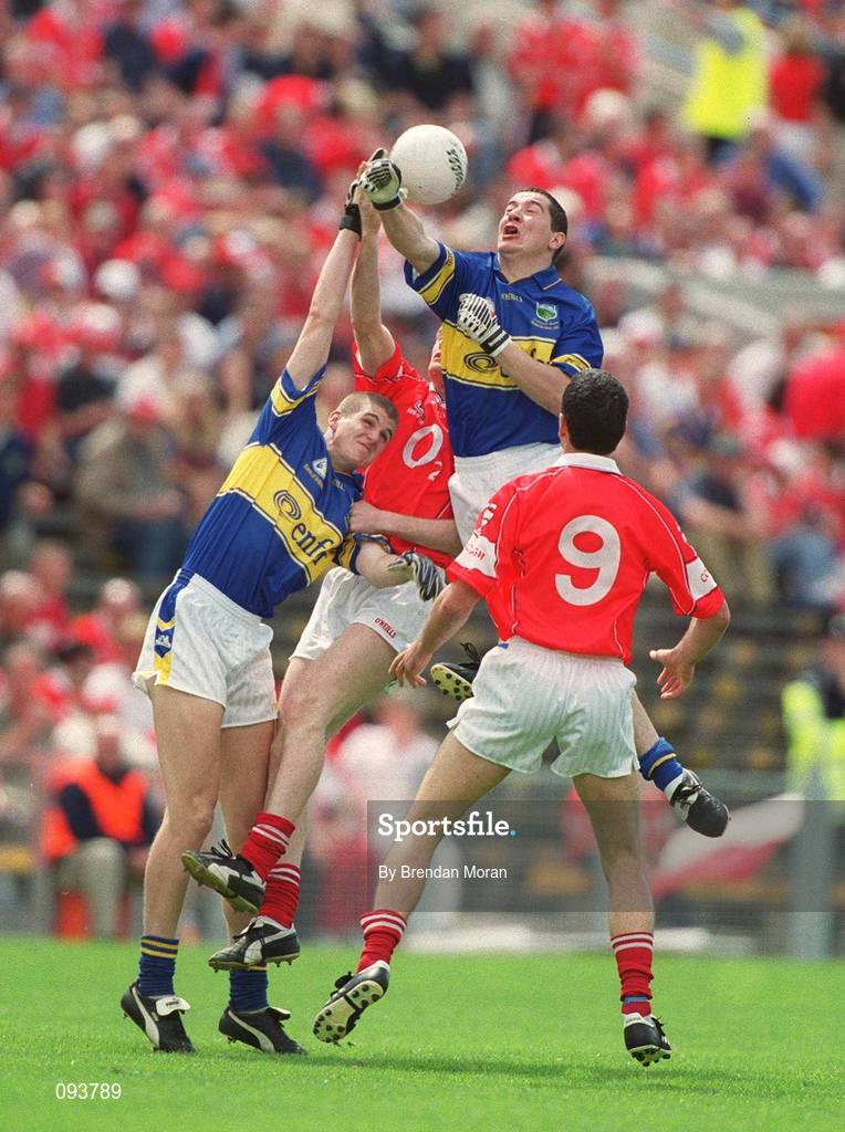 14 July 2002; Tipperary players Liam England, right, and Kevin Mulryan field a highball ahead of Nicholas Murphy of Cork during the Bank of Ireland Munster Senior Football Championship Final match between Cork and Tipperary at Semple Stadium in Thurles, Tipperary. Photo by Brendan Moran/Sportsfile