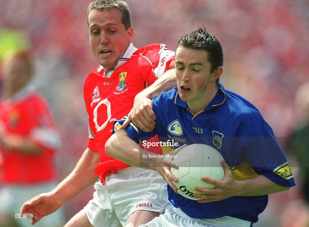 14 July 2002; Damien O'Brien of Tipperary in action against Ciaran O'Sullivan of Cork during the Bank of Ireland Munster Senior Football Championship Final match between Cork and Tipperary at Semple Stadium in Thurles, Tipperary. Photo by Brendan Moran/Sportsfile