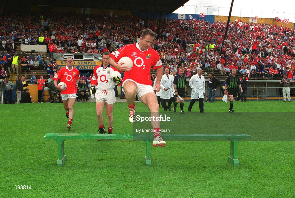 14 July 2002; Cork captain Colin Corkery jumps the bench before the team photograph before the Bank of Ireland Munster Senior Football Championship Final match between Cork and Tipperary at Semple Stadium in Thurles, Tipperary. Photo by Brendan Moran/Sportsfile