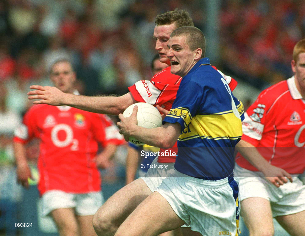 14 July 2002; Kevin Mulryan of Tipperary in action against Nicholas Murphy of Cork during the Bank of Ireland Munster Senior Football Championship Final match between Cork and Tipperary at Semple Stadium in Thurles, Tipperary. Photo by Pat Murphy/Sportsfile