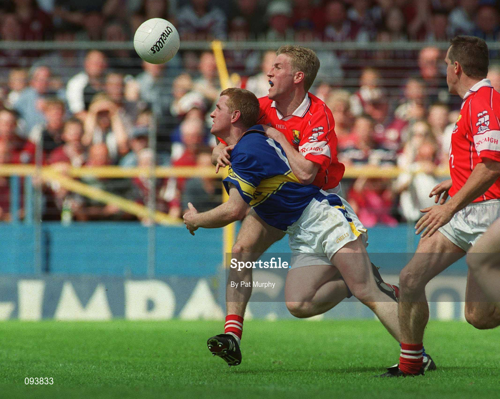 14 July 2002; Paul Cahill of Tipperary in action against Anthony Lynch of Cork during the Bank of Ireland Munster Senior Football Championship Final match between Cork and Tipperary at Semple Stadium in Thurles, Tipperary. Photo by Pat Murphy/Sportsfile