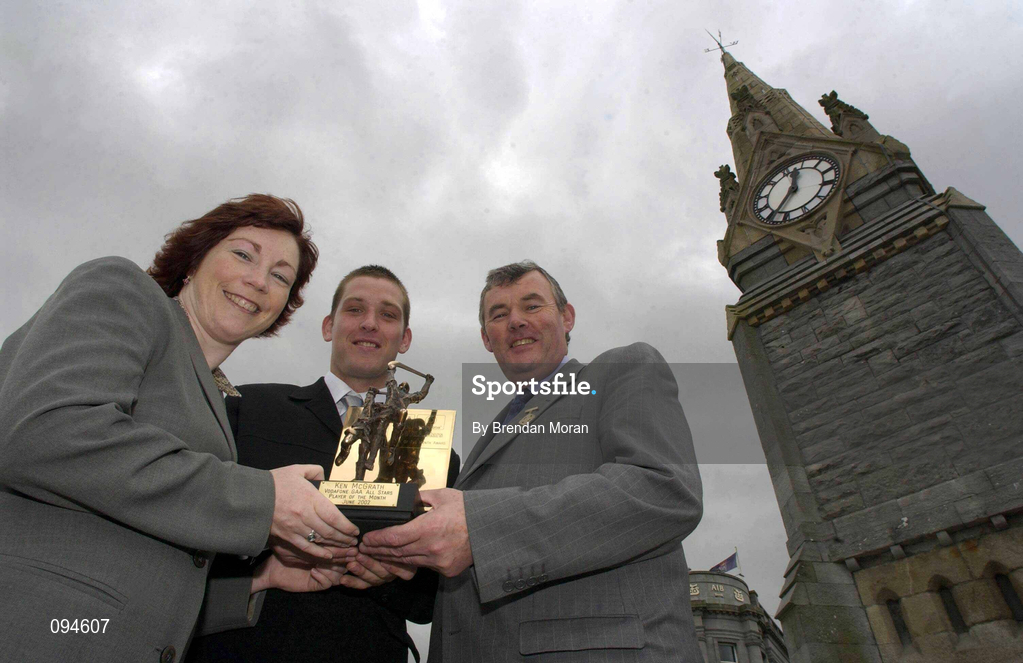 23 July 2002; Waterford hurler Ken McGrath who was named Vodafone GAA All-Stars Player of the Month for June at a luncheon at the Granville Hotel in Waterford, is presented with his award by Hilda Carroll, Sponsorship Manager, Vodafone and Sean McCague, President of the GAA. Photo by Brendan Moran/Sportsfile