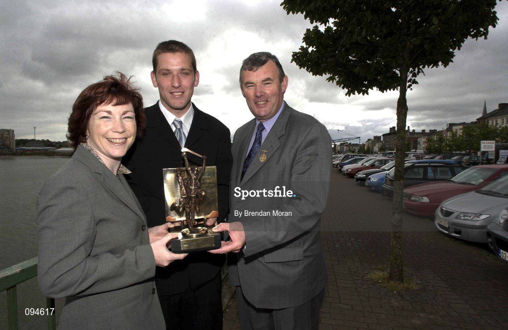 23 July 2002; Waterford hurler Ken McGrath who was named Vodafone GAA All-Stars Player of the Month for June at a luncheon at the Granville Hotel in Waterford, is presented with his award by Hilda Carroll, Sponsorship Manager, Vodafone and Sean McCague, President of the GAA. Photo by Brendan Moran/Sportsfile