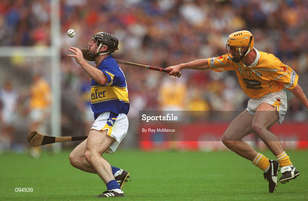 28 July 2002; Eoin Kelly of Tipperary in action against Ciarán Herron of Antrim during the All-Ireland Senior Hurling Championship Quarter-Final match between Antrim and Tipperary at Croke Park in Dublin. Photo by Ray McManus/Sportsfile
