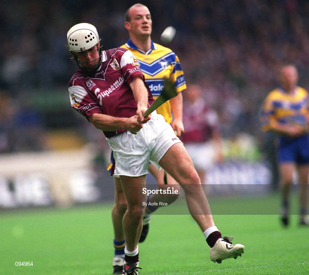 28 July 2002; David Tierney of Galway shoots under pressure from Ollie Baker of Clare during the Guinness All-Ireland Senior Hurling Championship Quarter-Final match between Clare and Galway at Croke Park. Photo by Ray McManus/Sportsfile