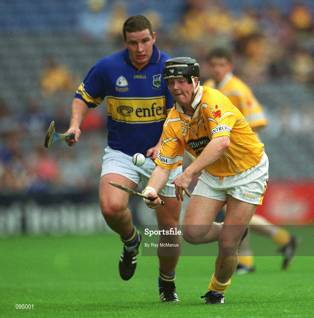 28 July 2002; Karl McKeegan of Antrim in action against John Carroll of Tipperary during the All-Ireland Senior Hurling Championship Quarter-Final match between Antrim and Tipperary at Croke Park in Dublin. Photo by Ray McManus/Sportsfile