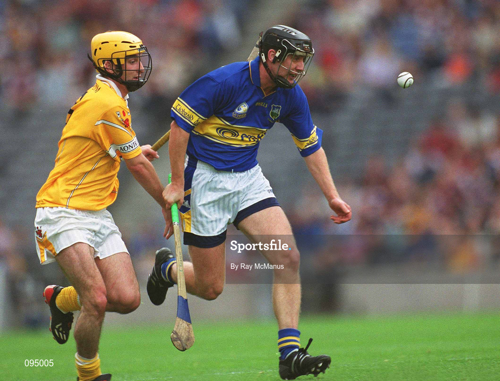 28 July 2002; Eddie Enright of Tipperary in action against Conor Cunning of Antrim during the All-Ireland Senior Hurling Championship Quarter-Final match between Antrim and Tipperary at Croke Park in Dublin. Photo by Ray McManus/Sportsfile