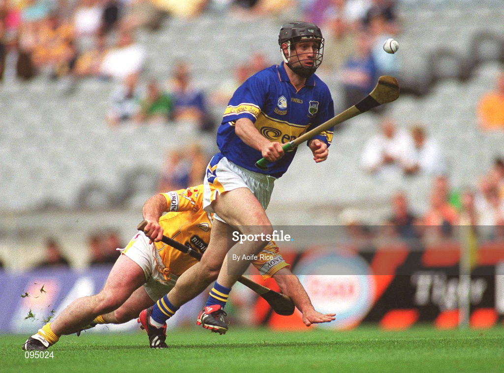28 July 2002; Thomas Dunne of Tipperary in action against Kieran Kelly of Antrim during the All-Ireland Senior Hurling Championship Quarter-Final match between Antrim and Tipperary at Croke Park in Dublin. Photo by Aoife Rice/Sportsfile