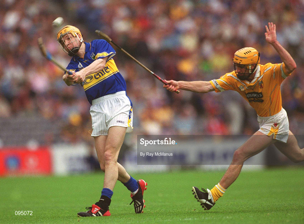 28 July 2002; Lar Corbett of Tipperary in action against Karl McKeegan of Antrim during the All-Ireland Senior Hurling Championship Quarter-Final match between Antrim and Tipperary at Croke Park in Dublin. Photo by Ray McManus/Sportsfile
