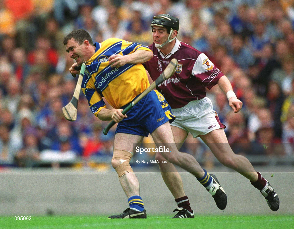 28 July 2002; Eugene Cloonan of Galway attempts to tackle Brian Quinn of Clare after he had broken his hurl on Quinn's forehead during the Guinness All-Ireland Senior Hurling Championship Quarter-Final match between Clare and Galway at Croke Park. Photo by Ray McManus/Sportsfile