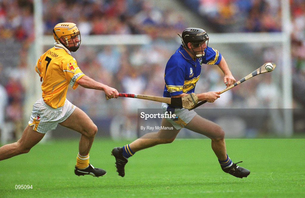 28 July 2002; Mark O'Leary of Tipperary races clear of Ciarán Herron of Antrim during the All-Ireland Senior Hurling Championship Quarter-Final match between Antrim and Tipperary at Croke Park in Dublin. Photo by Ray McManus/Sportsfile