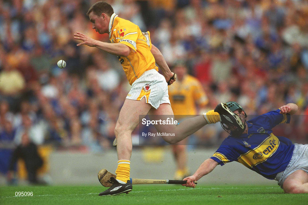 28 July 2002; Paddy Richmond of Antrim in action against David Kennedy of Tipperary during the All-Ireland Senior Hurling Championship Quarter-Final match between Antrim and Tipperary at Croke Park in Dublin. Photo by Ray McManus/Sportsfile