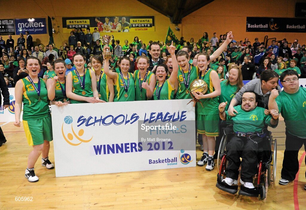 22 March 2012; Clonaslee Vocational School captain Meaghan Dunne lifts the cup as her team-mates celebrate. U16C Girls - All-Ireland Schools League Finals 2012, Aquinas Grammar, Belfast v Clonaslee Vocational School, Laois, National Basketball Arena, Tallaght, Dublin. Picture credit: Matt Browne / SPORTSFILE