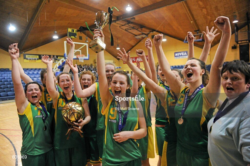 22 March 2012; Clonaslee Vocational School captain Meaghan Dunne lifts the cup as her team-mates celebrate. U16C Girls - All-Ireland Schools League Finals 2012, Aquinas Grammar, Belfast v Clonaslee Vocational School, Laois, National Basketball Arena, Tallaght, Dublin. Picture credit: Matt Browne / SPORTSFILE