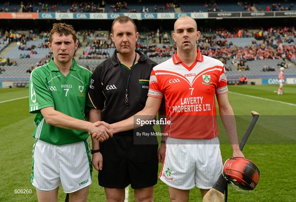 17 March 2012; The captains, Brendan O'Meara, left, Coolderry, and Johnny Campbell, Loughgiel Shamrocks, shake hands accross referee Alan Kelly before the game. AIB GAA Hurling All-Ireland Senior Club Championship Final, Coolderry, Offaly, v Loughgiel Shamrocks, Antrim, Croke Park, Dublin. Picture credit: Ray McManus / SPORTSFILE