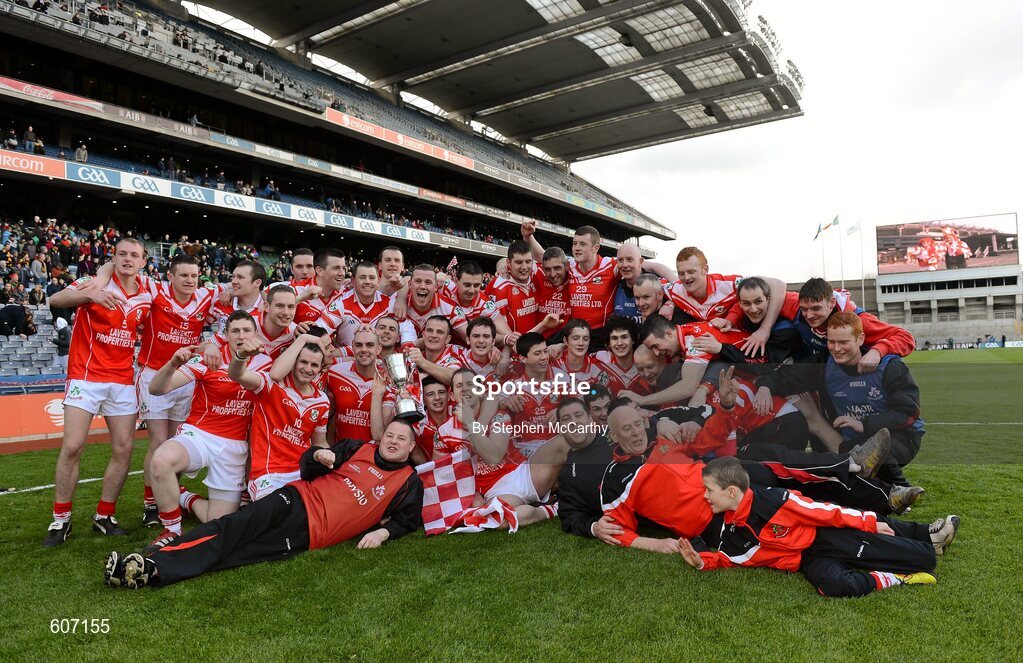 17 March 2012; Loughgiel Shamrocks players and managment celebrate with the Tommy Moore Cup. AIB GAA Hurling All-Ireland Senior Club Championship Final, Coolderry, Offaly, v Loughgiel Shamrocks, Antrim. Croke Park, Dublin. Picture credit: Stephen McCarthy / SPORTSFILE
