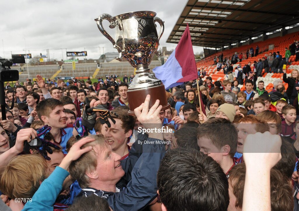19 March 2012; St. Michael’s manager Dominic Corrigan lifts the cup alongside players and supporters. MacRory Cup Final, St. Patrick’s, Maghera v St. Michael’s, Enniskillen, Bessbrook, Morgan Athletic Grounds, Armagh. Picture credit: Oliver McVeigh / SPORTSFILE