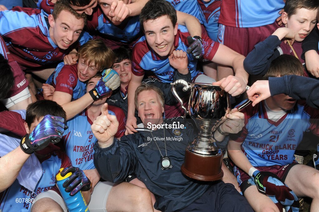19 March 2012; St. Michael’s manager Dominic Corrigan celebrates with the cup alongside players and supporters. MacRory Cup Final, St. Patrick’s, Maghera v St. Michael’s, Enniskillen, Bessbrook, Morgan Athletic Grounds, Armagh. Picture credit: Oliver McVeigh / SPORTSFILE