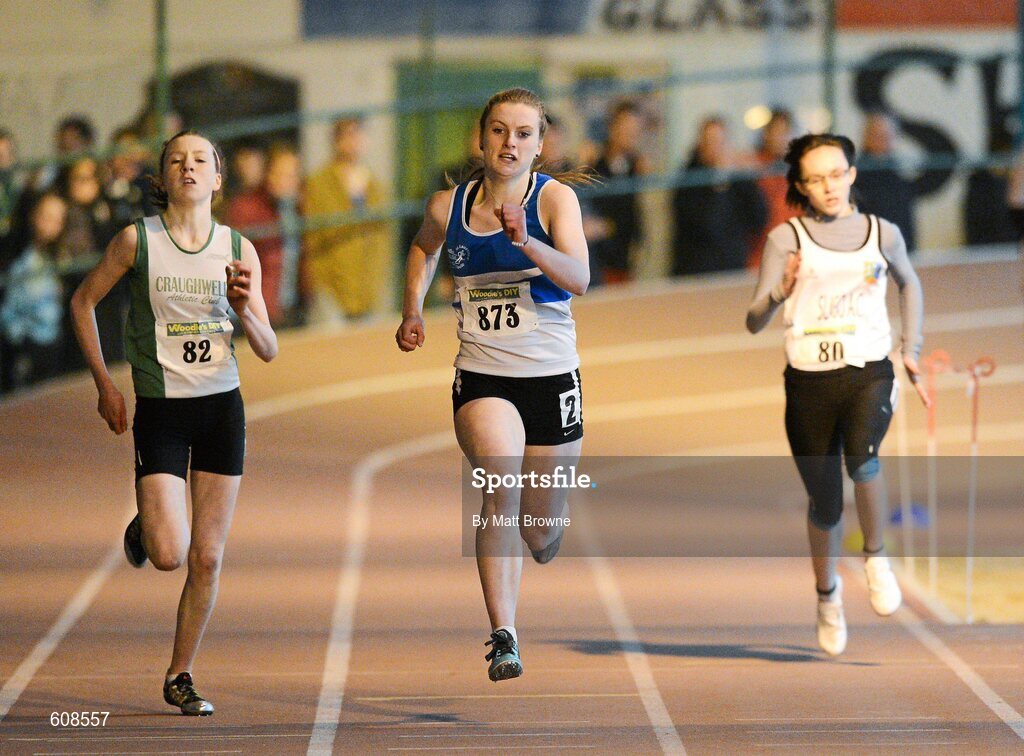 31 March 2012; Grace Lawler, St. Laurance O'Toole Athletic Club, Co. Carlow, on her way to winning the Girls Under 16 200m from second place Sinead Treacy, left, Craughwell Athletic Club, Co. Galway, and Stacey Kerr, Sligo Athletic Club, Co. Sligo, during the Woodie’s DIY AAI Juvenile Indoor Championships of Ireland. Nenagh Indoor Arena, Nenagh, Co. Tipperary. Picture credit: Matt Browne / SPORTSFILE