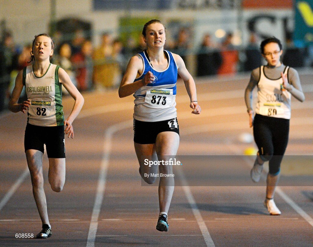 31 March 2012; Grace Lawler, St. Laurance O'Toole Athletic Club, Co. Carlow, on her way to winning the Girls Under 16 200m from second place Sinead Treacy, left, Craughwell Athletic Club, Co. Galway, and Stacey Kerr, Sligo Athletic Club, Co. Sligo, during the Woodie’s DIY AAI Juvenile Indoor Championships of Ireland. Nenagh Indoor Arena, Nenagh, Co. Tipperary. Picture credit: Matt Browne / SPORTSFILE