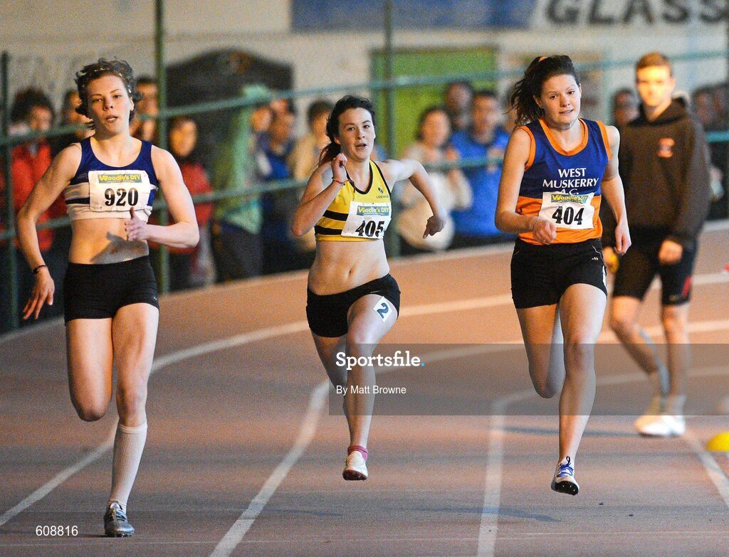 31 March 2012; Claire Murphy, left, St. Laurence O'Toole AC, Co. Carlow, on her way to winning the Girls Under 19 200m Final from eventual second place Grainne Moynihan, right, West Muskerry AC, Co. Kerry, and eventual fourth place Jessica Sheeham, Leevale AC, Co. Cork, during the Woodie’s DIY AAI Juvenile Indoor Championships of Ireland. Nenagh Indoor Arena, Nenagh, Co. Tipperary. Picture credit: Matt Browne / SPORTSFILE