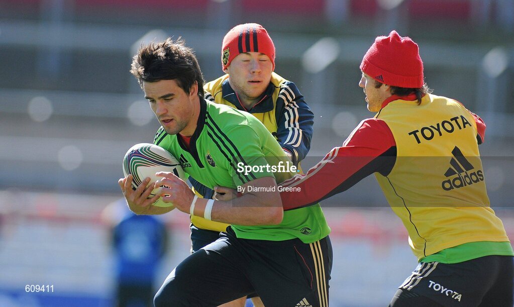 4 April 2012; Munster's Conor Murray is tackled by Luke O'Dea, left, and Duncan Williams during squad training ahead of their Heineken Cup Quarter-Final game against Ulster on Sunday. Munster Rugby Squad Training, Thomond Park, Limerick. Picture credit: Diarmuid Greene / SPORTSFILE