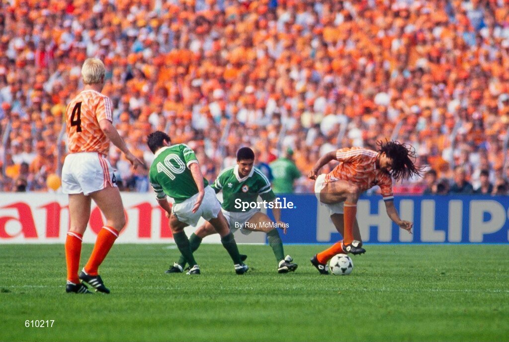 18 June 1988; Ruud Gullit of Netherlands in action against Chris Hughton and Frank Stapleton, left, of Republic of Ireland during the UEFA European Football Championship Finals Group B match between Republic of Ireland and Netherlands at Parkstadion in Gelsenkirchen, Germany. Photo by Ray McManus/Sportsfile