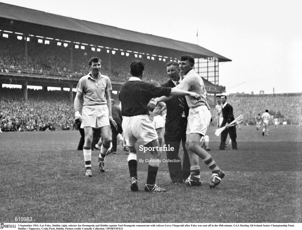 3 September 1961; Lar Foley, Dublin, right, selector Joe Drumgoole and Dublin captain Noel Drumgoole remonstrate with referee Gerry Fitzgerald after Foley was sent off in the 45th minute. GAA Hurling All-Ireland Senior Championship Final, Dublin v Tipperary, Croke Park, Dublin. Picture credit: Connolly Collection / SPORTSFILE