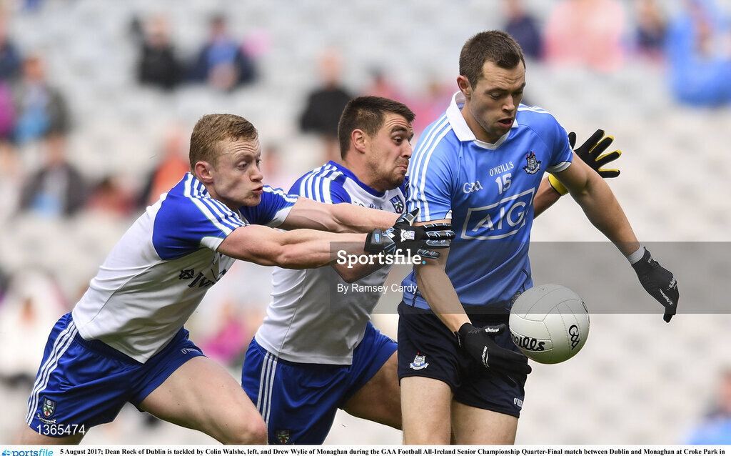 5 August 2017; Dean Rock of Dublin is tackled by Colin Walshe, left, and Drew Wylie of Monaghan during the GAA Football All-Ireland Senior Championship Quarter-Final match between Dublin and Monaghan at Croke Park in Dublin. Photo by Ramsey Cardy/Sportsfile