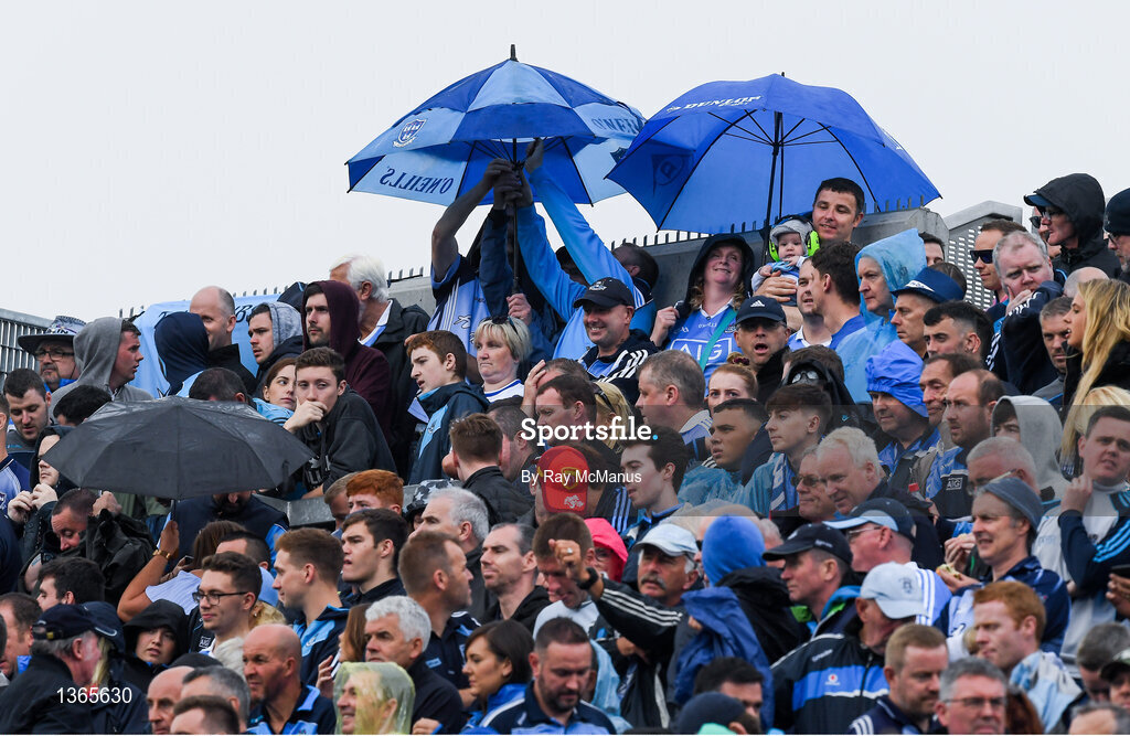 5 August 2017; Supporters on Hill 16 use an umberella to shade a small child from the prevailing rain, as others to the left try and fix theirs, during the GAA Football All-Ireland Senior Championship Quarter-Final match between Dublin and Monaghan at Croke Park in Dublin. Photo by Ray McManus/Sportsfile