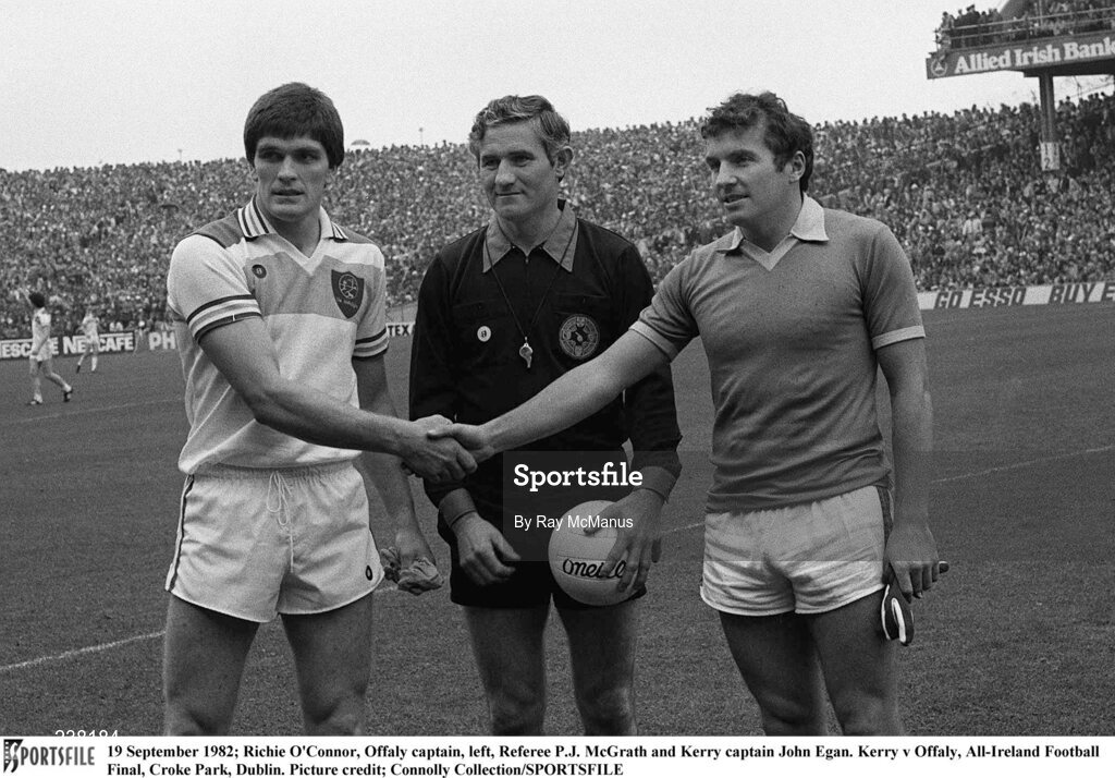 19 September 1982; Team captains Richie Connor of Offaly and John Egan of Kerry shake hands in the company of referee PJ McGrath before the All-Ireland Football Final match between Offaly and Kerry at Croke Park, Dublin. Photo by Connolly Collection/Sportsfile