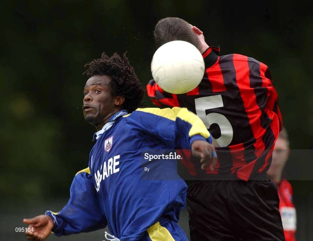 28 July 2002; Eric Levine, Longford Town, in action against CIE Ranch's Cormac Flannery, CIE Ranch v Longford Town, FAI Carlsberg Senior Cup, second round, Richmond Park, Dublin. Soccer. Picture credit; David Maher / SPORTSFILE *EDI*